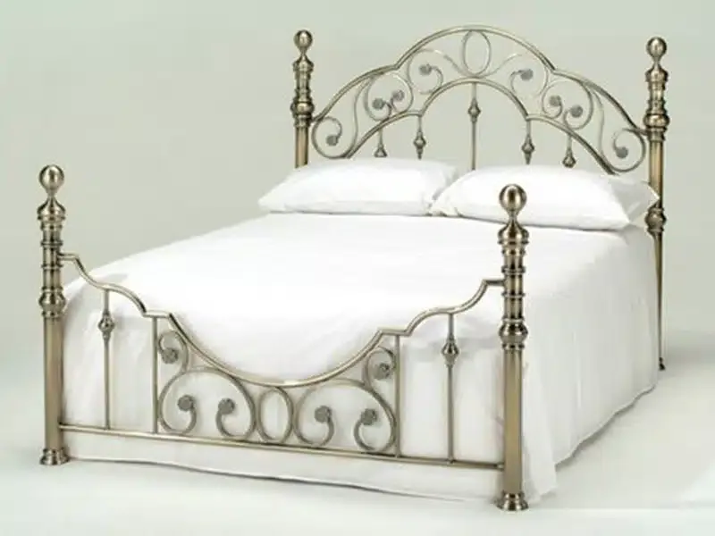 Cama bronce arco volutas